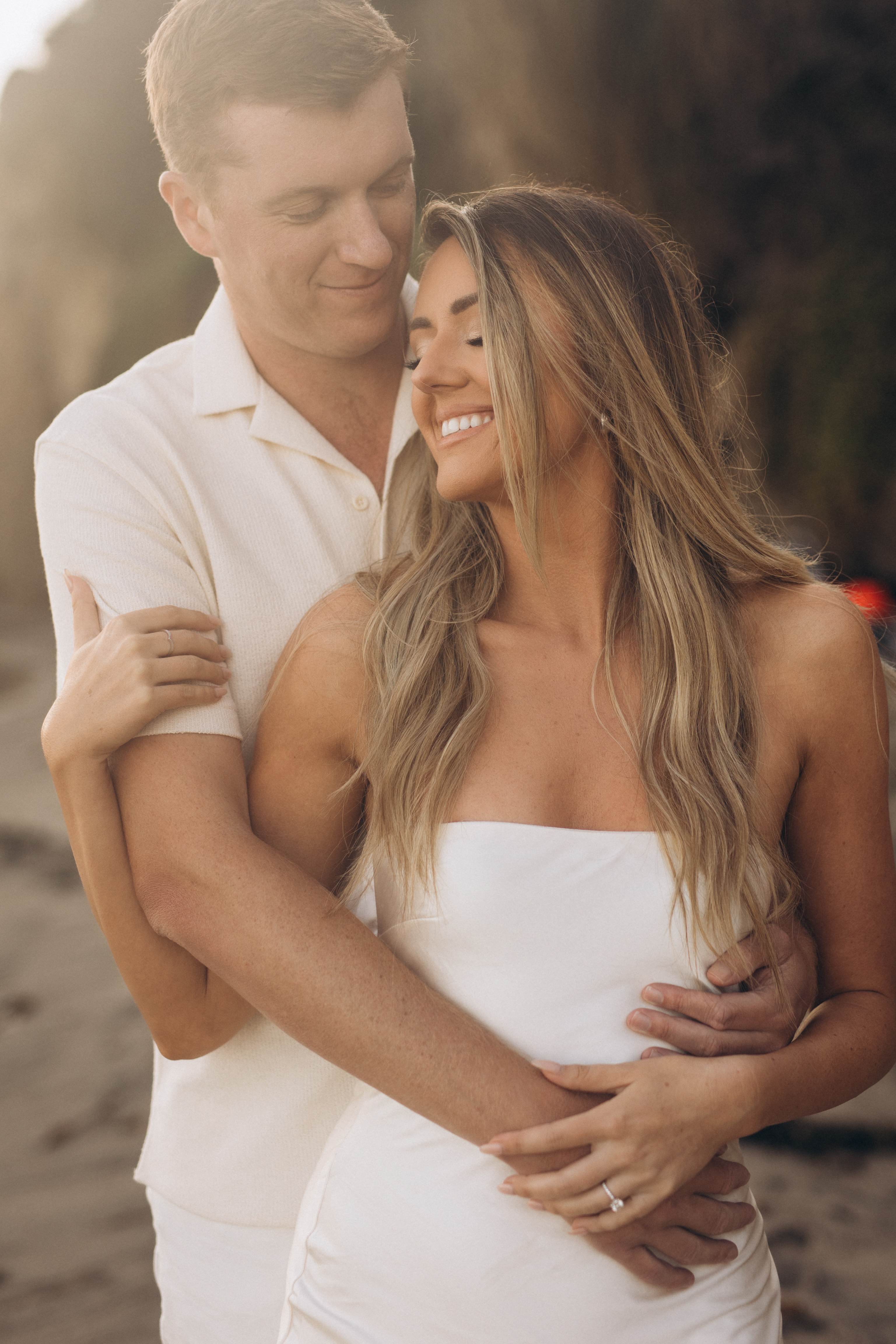 Intimate couple portrait embrace on the beach